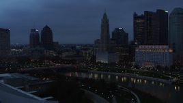 5.7K aerial stock footage of a reverse view of LeVeque Tower across the river at twilight, Downtown Columbus, Ohio Aerial Stock Footage | DX0001_002773