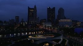 5.7K aerial stock footage of flying by the city skyline across the river at twilight, Downtown Columbus, Ohio Aerial Stock Footage | DX0001_002774
