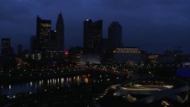 5.7K aerial stock footage of the city skyline across the bridge and river at twilight during ascent, Downtown Columbus, Ohio Aerial Stock Footage | DX0001_002777