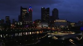 5.7K aerial stock footage of the city's skyline across the river at twilight during ascent in Downtown Columbus, Ohio Aerial Stock Footage | DX0001_002784