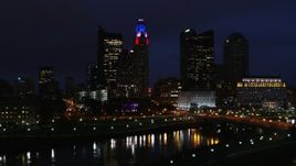 5.7K aerial stock footage ascend to reveal the river and approach city skyline at night, Downtown Columbus, Ohio Aerial Stock Footage | DX0001_002793