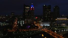 5.7K aerial stock footage fly away from city skyline at night, reveal river, bridge and concert hall, Downtown Columbus, Ohio Aerial Stock Footage | DX0001_002794