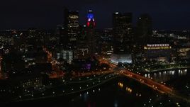5.7K aerial stock footage of flying by LeVeque Tower and city skyline at night, Downtown Columbus, Ohio Aerial Stock Footage | DX0001_002797