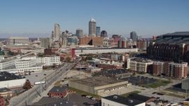 5.7K aerial stock footage of the city skyline behind convention center during descent, Downtown Indianapolis, Indiana Aerial Stock Footage | DX0001_002808