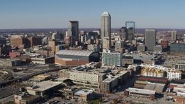 5.7K aerial stock footage of flying away from arena and the city's skyline in Downtown Indianapolis, Indiana Aerial Stock Footage | DX0001_002840