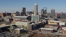5.7K aerial stock footage fly away from arena and by the city's skyline in Downtown Indianapolis, Indiana Aerial Stock Footage | DX0001_002845