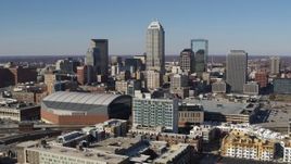 5.7K aerial stock footage passing by the city's skyline near the arena in Downtown Indianapolis, Indiana Aerial Stock Footage | DX0001_002850