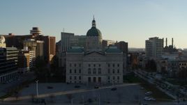 5.7K aerial stock footage flying by the Indiana State House in Downtown Indianapolis, Indiana Aerial Stock Footage | DX0001_002906