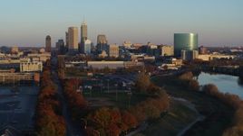 5.7K aerial stock footage of the city's skyline seen from the White River at sunset, Downtown Indianapolis, Indiana Aerial Stock Footage | DX0001_002922