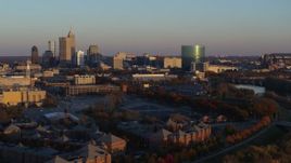 5.7K aerial stock footage of flying by the city's skyline at sunset, Downtown Indianapolis, Indiana Aerial Stock Footage | DX0001_002928