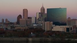 5.7K aerial stock footage flyby hotel for view of the city's skyline at sunset, Downtown Indianapolis, Indiana Aerial Stock Footage | DX0001_002937
