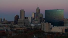 5.7K aerial stock footage approach the city's skyline and a hotel at sunset in Downtown Indianapolis, Indiana Aerial Stock Footage | DX0001_002949