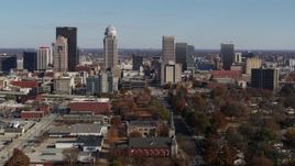 5.7K aerial stock footage flying by the city's skyline, seen near churches in Downtown Louisville, Kentucky Aerial Stock Footage | DX0001_002984