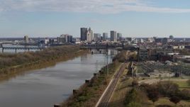 5.7K aerial stock footage ascend over river with view of the city's skyline in Downtown Louisville, Kentucky Aerial Stock Footage | DX0001_002996