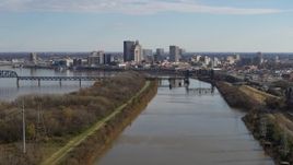 5.7K aerial stock footage flying by river with view of the city's skyline in Downtown Louisville, Kentucky Aerial Stock Footage | DX0001_002997