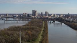 5.7K aerial stock footage of a view of the city's skyline beside the river in Downtown Louisville, Kentucky Aerial Stock Footage | DX0001_003002