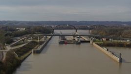 5.7K aerial stock footage approach locks and a dam on the Ohio River before ascent in Louisville, Kentucky Aerial Stock Footage | DX0001_003015