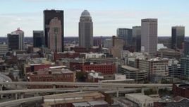 5.7K aerial stock footage of city skyline seen while flying by freeway offramp in Downtown Louisville, Kentucky Aerial Stock Footage | DX0001_003020