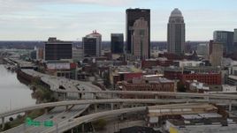 5.7K aerial stock footage descend near freeway with view of skyscrapers in Downtown Louisville, Kentucky Aerial Stock Footage | DX0001_003023