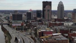 5.7K aerial stock footage fly away from skyscrapers in Downtown Louisville, Kentucky, descend by freeway Aerial Stock Footage | DX0001_003025