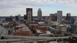 5.7K aerial stock footage of a reverse view of the city's skyline seen from an offramp in Downtown Louisville, Kentucky Aerial Stock Footage | DX0001_003027