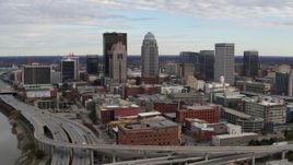 5.7K aerial stock footage ascend and fly away from freeway and city skyline in Downtown Louisville, Kentucky Aerial Stock Footage | DX0001_003031