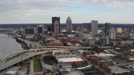 5.7K aerial stock footage fly away from freeway and past city skyline in Downtown Louisville, Kentucky Aerial Stock Footage | DX0001_003032