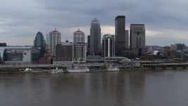 5.7K aerial stock footage descend and flyby the city skyline and Ohio River in Downtown Louisville, Kentucky Aerial Stock Footage | DX0001_003045