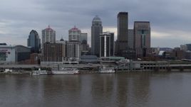 5.7K aerial stock footage descend while flying by the city skyline and Ohio River in Downtown Louisville, Kentucky Aerial Stock Footage | DX0001_003046