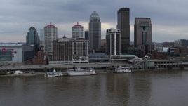5.7K aerial stock footage passing the city skyline beside the Ohio River during descent in Downtown Louisville, Kentucky Aerial Stock Footage | DX0001_003048