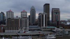 5.7K aerial stock footage fly over Ohio River to approach riverfront hotel and skyscrapers in Downtown Louisville, Kentucky Aerial Stock Footage | DX0001_003051