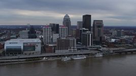 5.7K aerial stock footage fly over river to approach riverfront hotel and skyline, Downtown Louisville, Kentucky Aerial Stock Footage | DX0001_003055