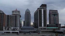 5.7K aerial stock footage passing hotel with skyscrapers in background, Downtown Louisville, Kentucky Aerial Stock Footage | DX0001_003059
