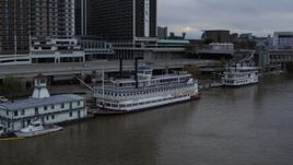 5.7K aerial stock footage of historic riverboat docked by Downtown Louisville, Kentucky Aerial Stock Footage | DX0001_003060