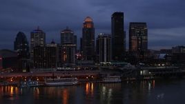 5.7K aerial stock footage reverse view of the skyline at twilight, seen from Ohio River, Downtown Louisville, Kentucky Aerial Stock Footage | DX0001_003096