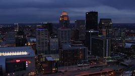 5.7K aerial stock footage of approaching the skyline lit up at twilight, Downtown Louisville, Kentucky Aerial Stock Footage | DX0001_003099