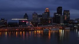 5.7K aerial stock footage approach the skyline and arena lit up at twilight from the Ohio River, Downtown Louisville, Kentucky Aerial Stock Footage | DX0001_003103
