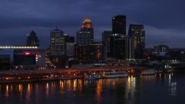 5.7K aerial stock footage stationary view of the skyline lit up at twilight, seen from Ohio River, Downtown Louisville, Kentucky Aerial Stock Footage | DX0001_003104