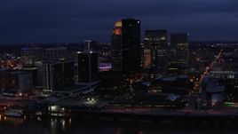 5.7K aerial stock footage reverse view of the city's skyline at twilight, reveal Ohio River, Downtown Louisville, Kentucky Aerial Stock Footage | DX0001_003108