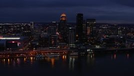 5.7K aerial stock footage slowly flyby the city's skyline at twilight, seen from across Ohio River, Downtown Louisville, Kentucky Aerial Stock Footage | DX0001_003110