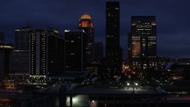 5.7K aerial stock footage of flying by a hotel and skyscrapers at twilight, Downtown Louisville, Kentucky Aerial Stock Footage | DX0001_003114