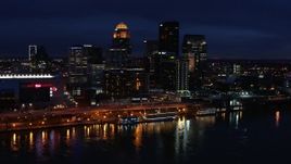 5.7K aerial stock footage slowly fly away from the city skyline at twilight, seen from the river, Downtown Louisville, Kentucky Aerial Stock Footage | DX0001_003119
