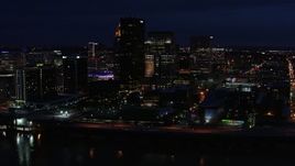 5.7K aerial stock footage slowly flying past the city skyline at twilight, seen from the river, Downtown Louisville, Kentucky Aerial Stock Footage | DX0001_003121