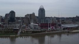 5.7K aerial stock footage a view of the baseball stadium and skyscraper during ascent over river, Downtown Cincinnati, Ohio Aerial Stock Footage | DX0001_003127