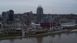 5.7K aerial stock footage descend toward river with view of the baseball stadium and skyscraper, Downtown Cincinnati, Ohio Aerial Stock Footage | DX0001_003128