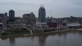 5.7K aerial stock footage slow pass over river with view of the baseball stadium and skyscraper, Downtown Cincinnati, Ohio Aerial Stock Footage | DX0001_003129