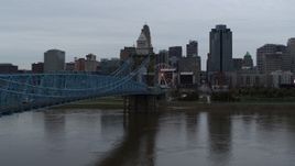 5.7K aerial stock footage ascend by bridge from river toward the city skyline, Downtown Cincinnati, Ohio Aerial Stock Footage | DX0001_003137