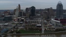 5.7K aerial stock footage reverse view of tall skyscraper and skyline, reveal Ohio River, Downtown Cincinnati, Ohio Aerial Stock Footage | DX0001_003144