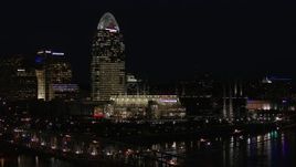 5.7K aerial stock footage descend by tall skyscraper and the baseball stadium at night, reveal bridge, Downtown Cincinnati, Ohio Aerial Stock Footage | DX0001_003196