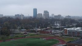 5.7K aerial stock footage ascend from football field for view of the city skyline, Downtown Lexington, Kentucky Aerial Stock Footage | DX0001_003203